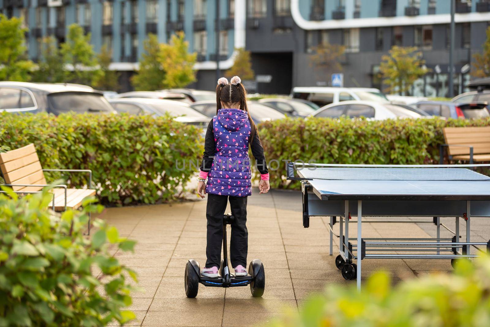 Little Girl Riding Segway Having Fun Spending Weekend