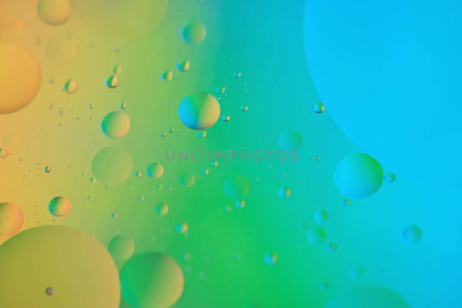 Rainbow abstract defocused background picture made with oil, water and soap by anytka