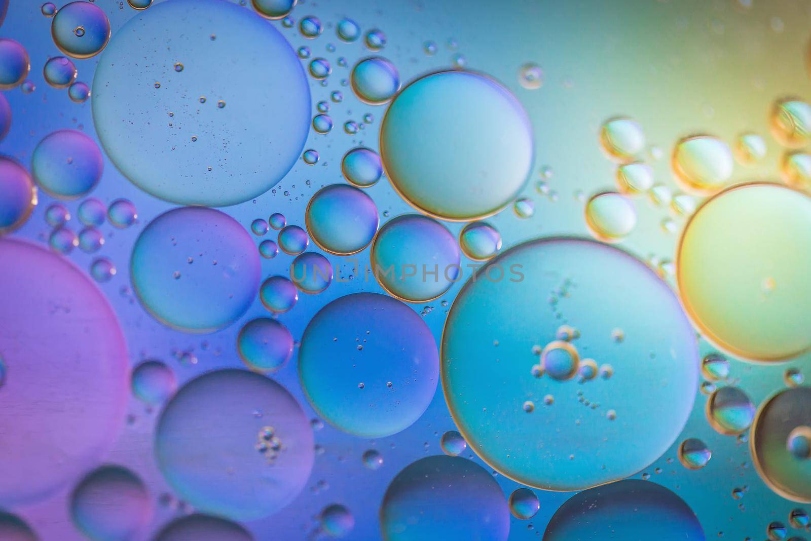 Oil drops in water. Abstract psychedelic pattern image multicolored. Abstract background with colorful gradient colors. Dof.