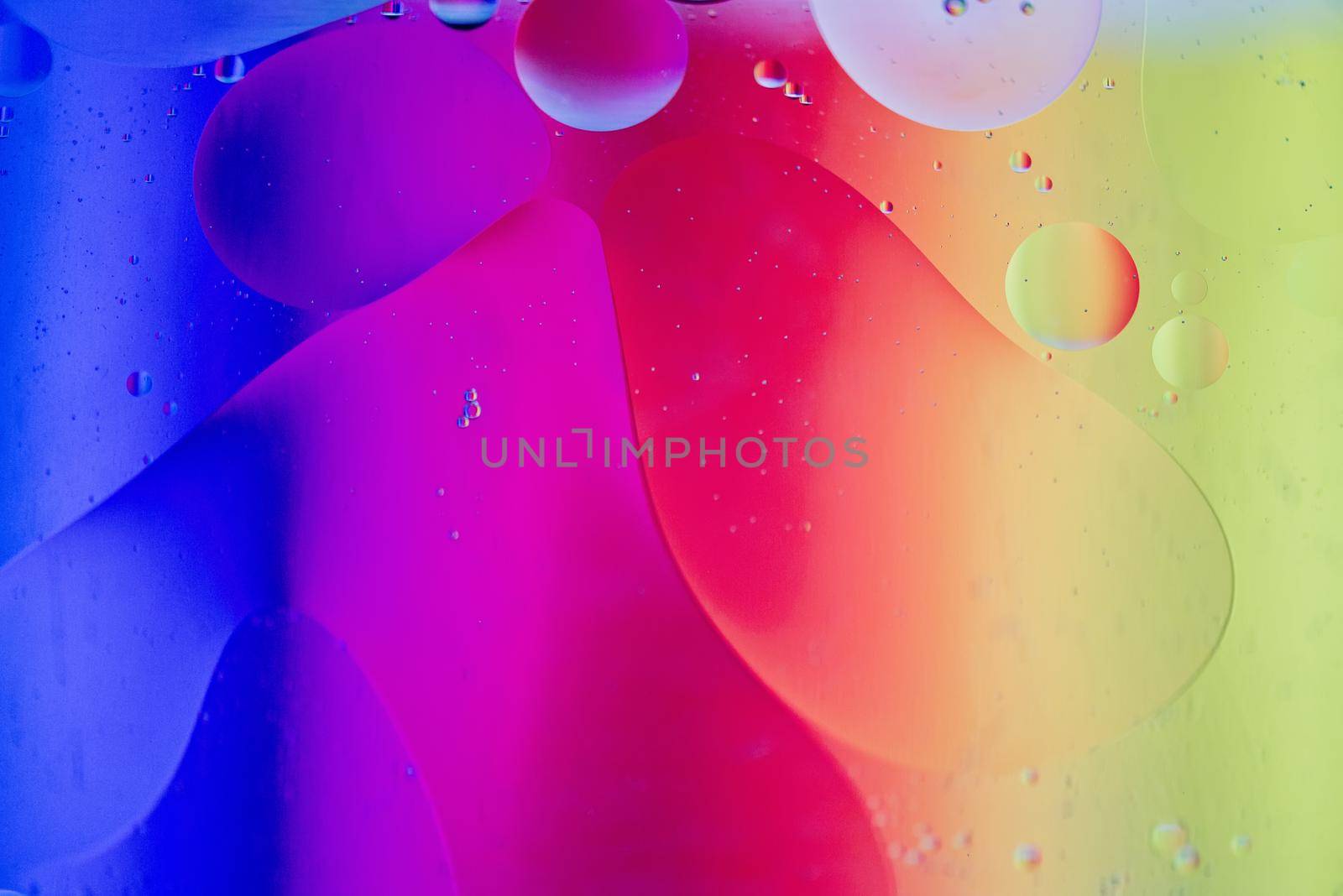 Rainbow abstract defocused background picture made with oil, water and soap by anytka