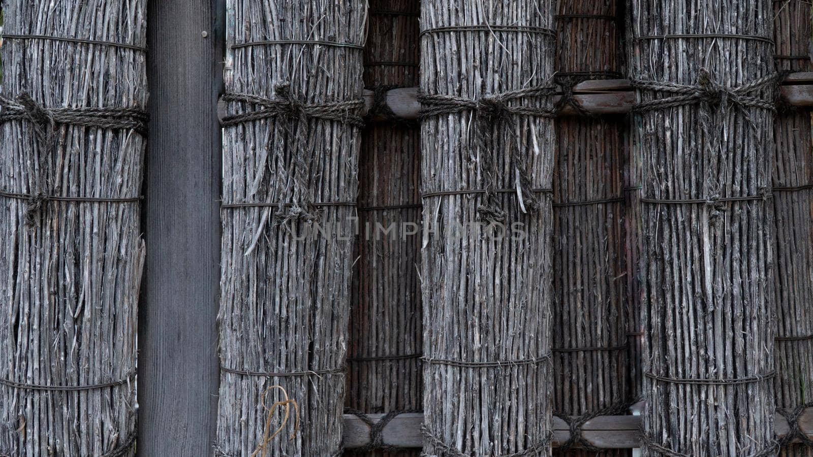 Decorative hedge of bunches of dry rods and tree branches by voktybre