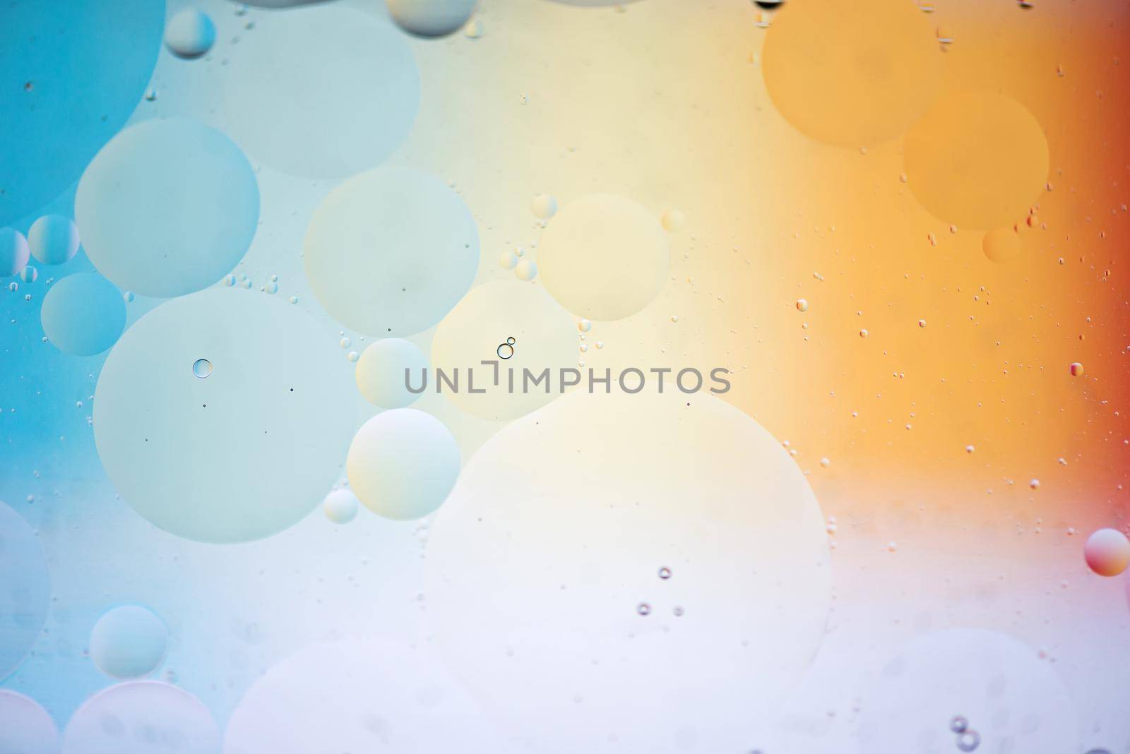 Oil drops in water. Abstract psychedelic pattern image rainbow colored. Abstract background with colorful gradient colors. DOF