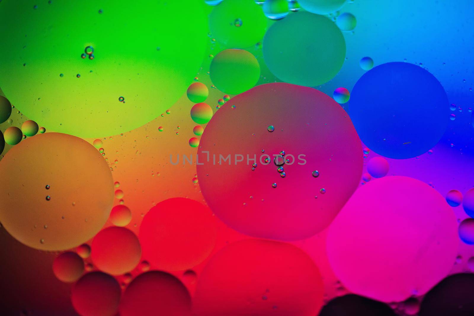 Oil drops in water. Abstract psychedelic pattern image rainbow colored. Abstract background with colorful gradient colors. DOF