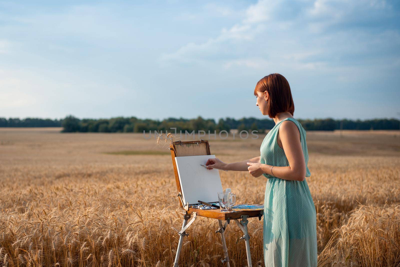 Artist making preliminary sketches with a pencil