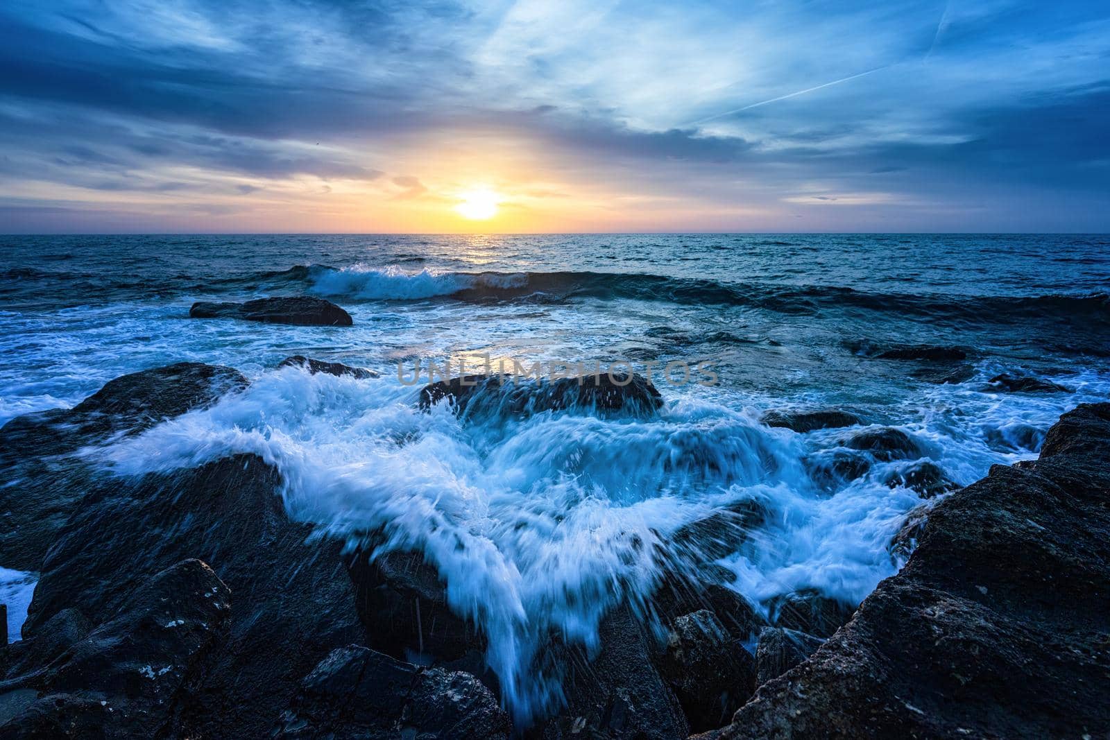 Blue hour in the sunrise at the sea shore. Horizontal view