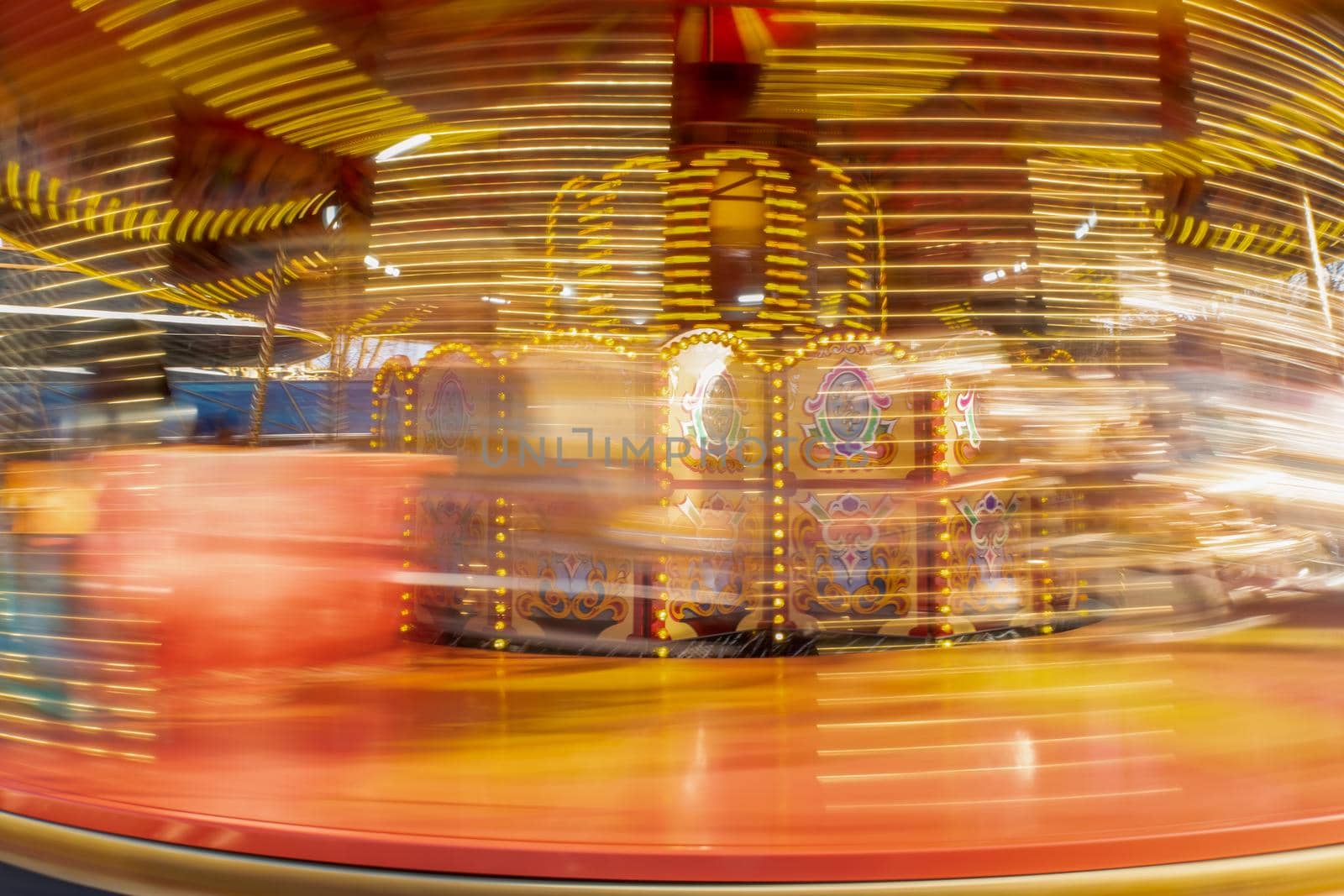 Long exposure of a spinning carousel ride by magicbones