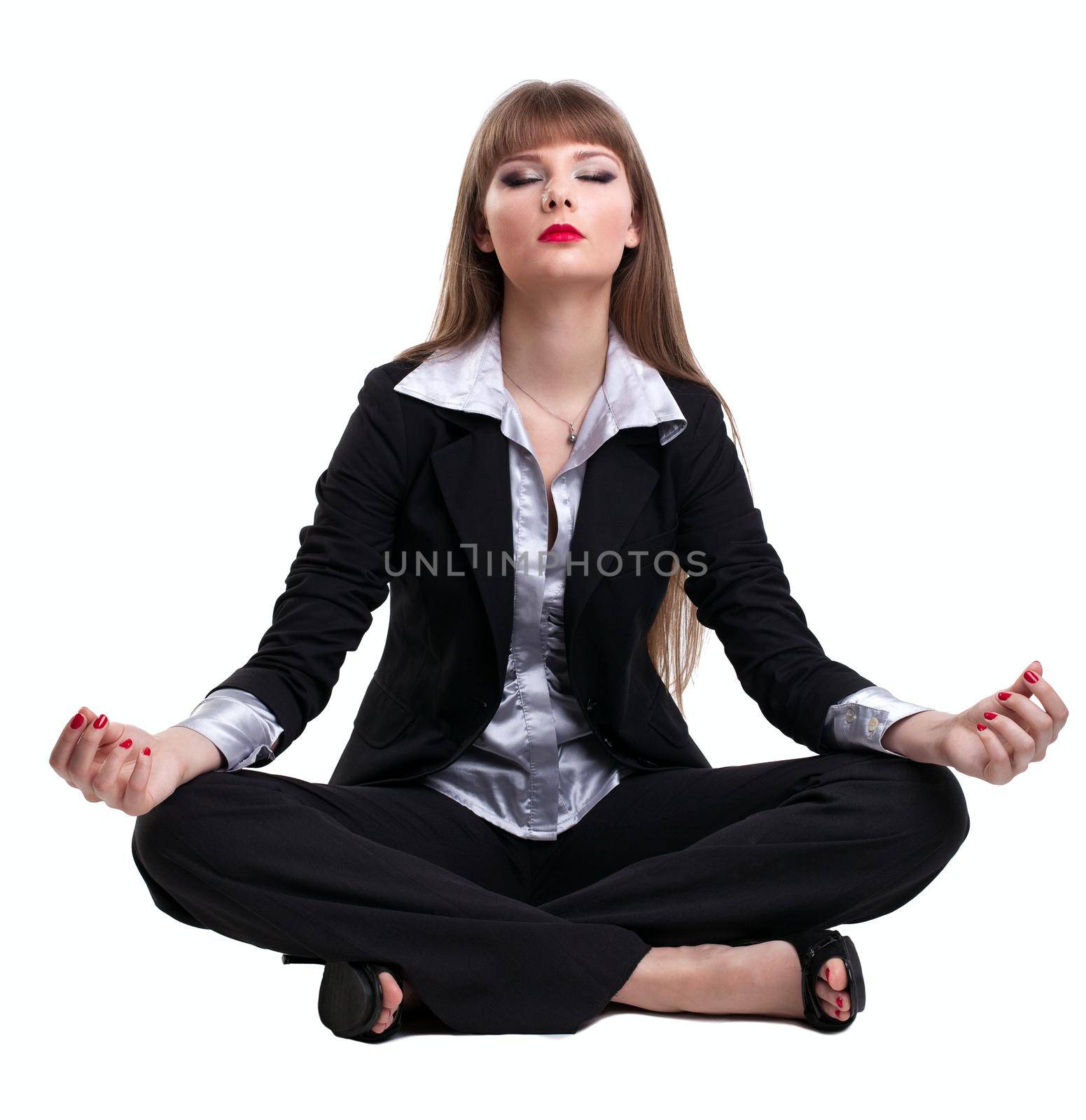 Yong business woman sit in yoga pose by rivertime