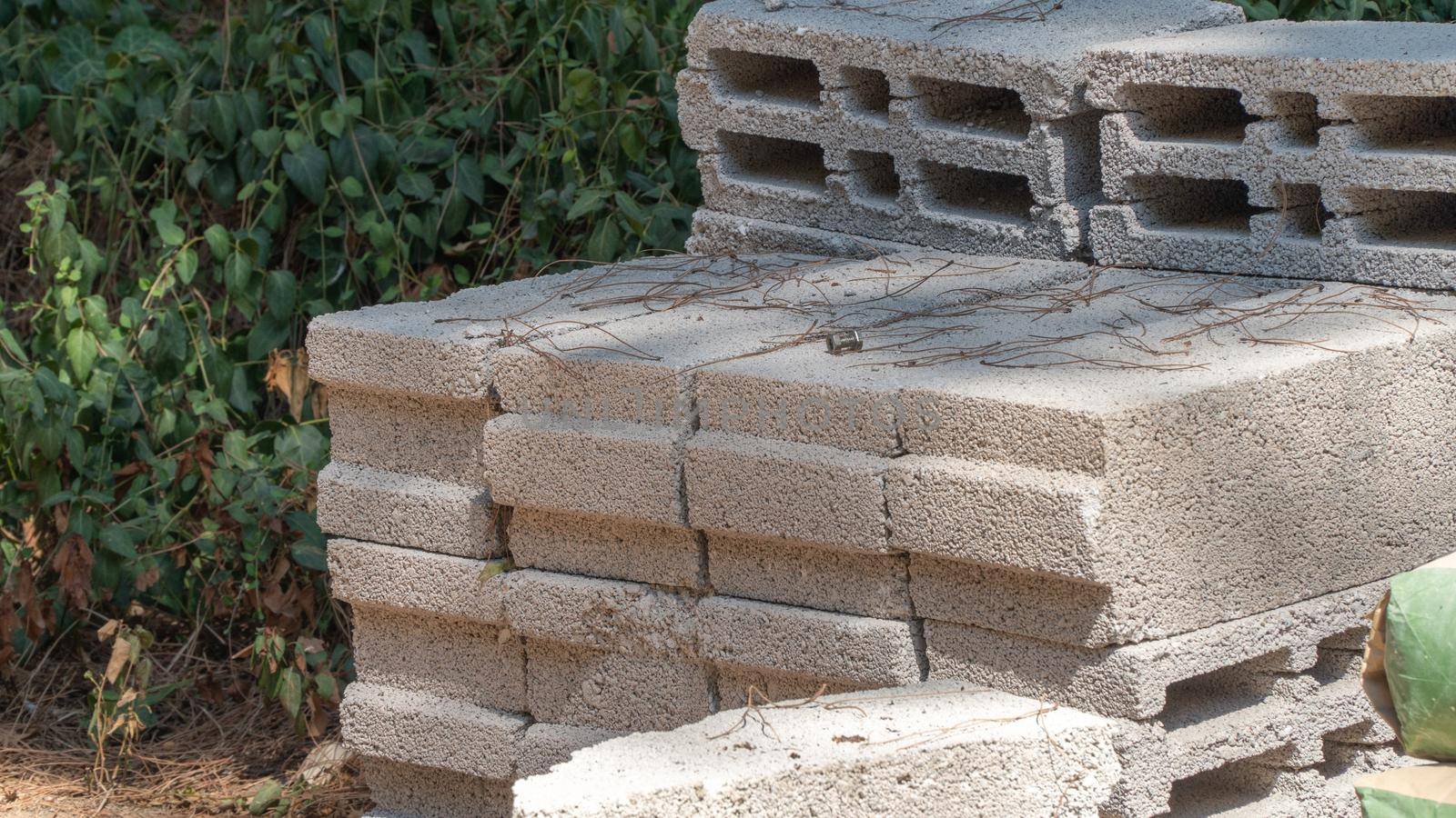 Concrete bricks and blocks on the street, building material for repair and construction by voktybre