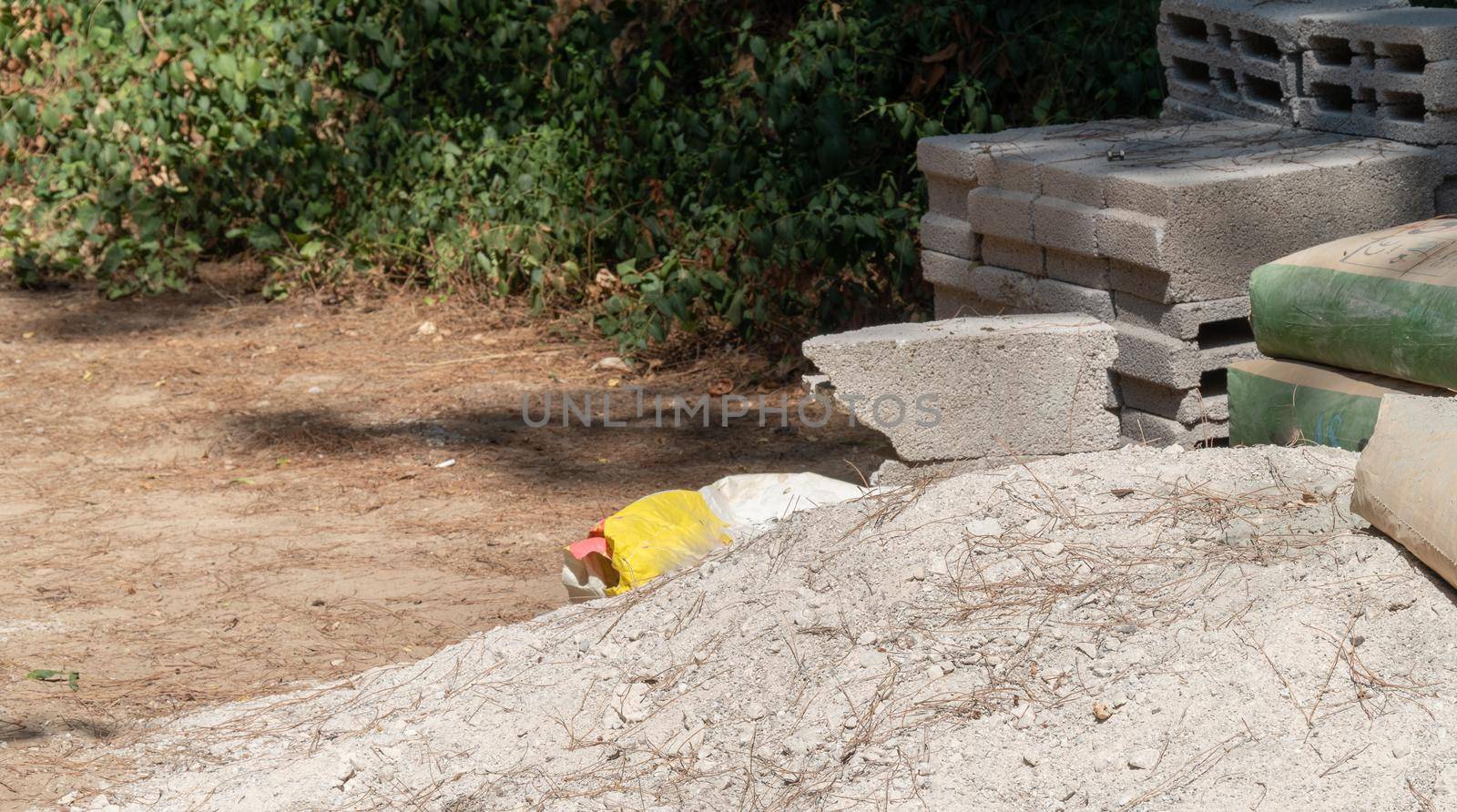 Building materials - sand, cement bags, concrete blocks. High quality photo