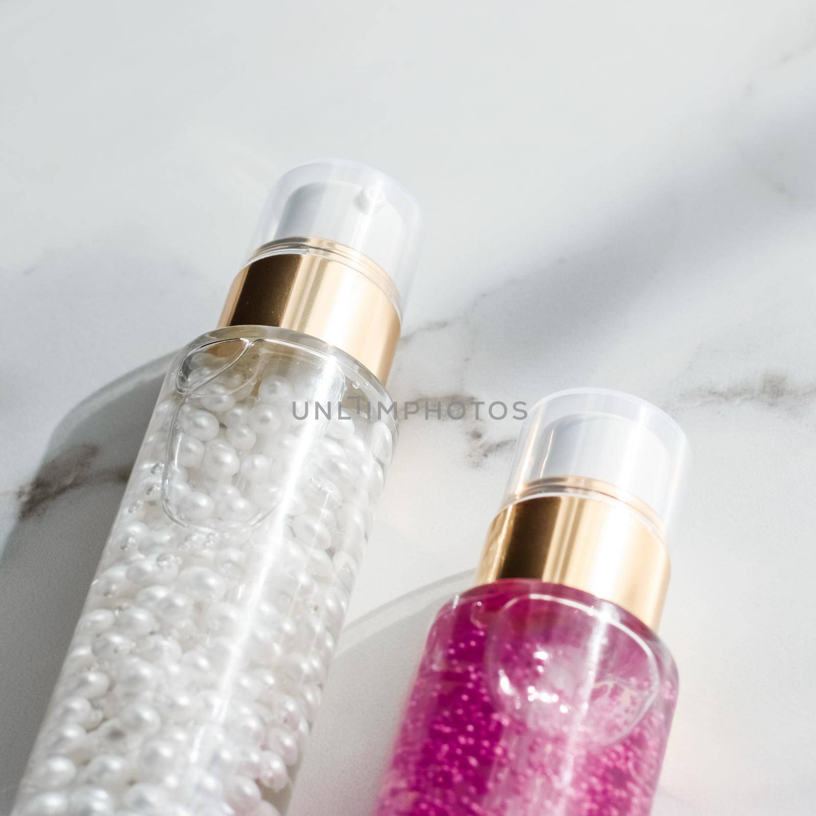 Cosmetic branding, packaging and make-up concept - Skin care serum and gel bottle, moisturizing lotion and lifting cream emulsion on marble, anti-age cosmetics for luxury beauty skincare brand design