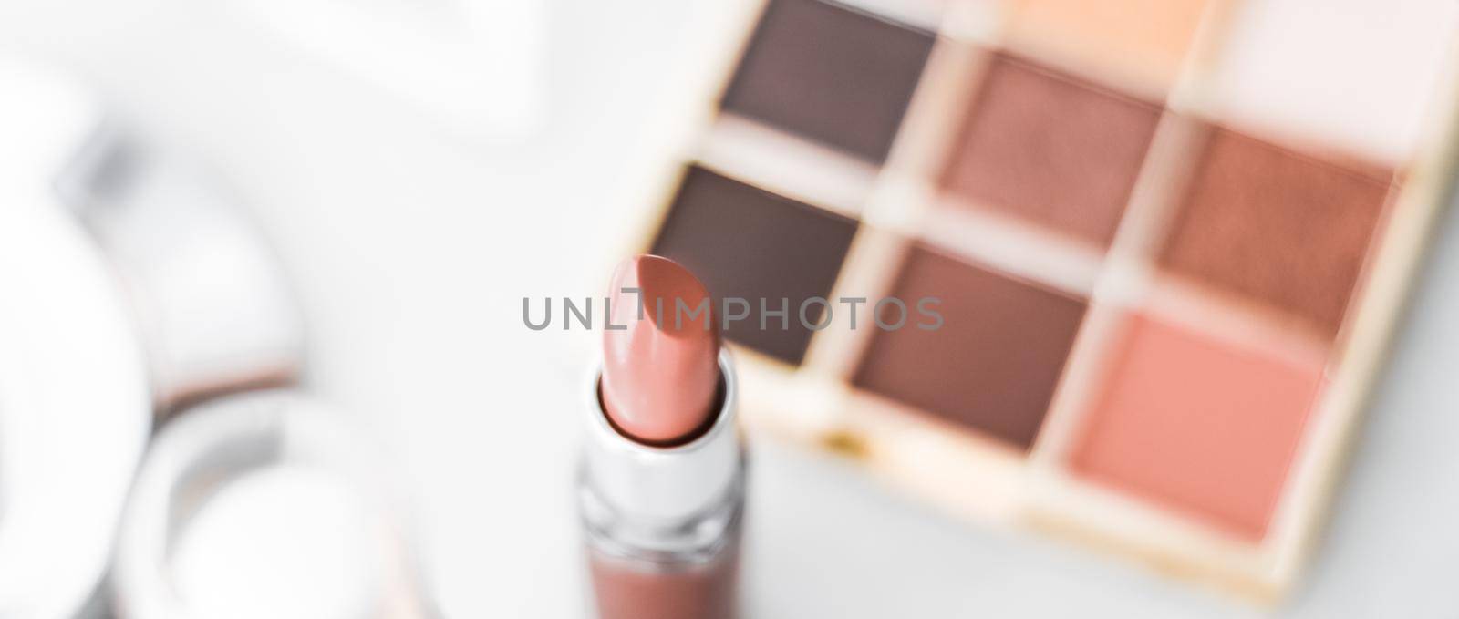 Cosmetics, makeup products on dressing vanity table, lipstick, foundation base, nailpolish and eyeshadows for luxury beauty and fashion brand ads design by Anneleven