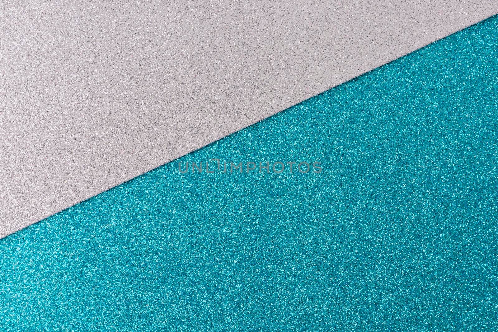 Shiny and glittering surface. Silver and blue, turquoise, abstract background. Events, celebrations. Trendy backdrop for your design. Texture with glitter