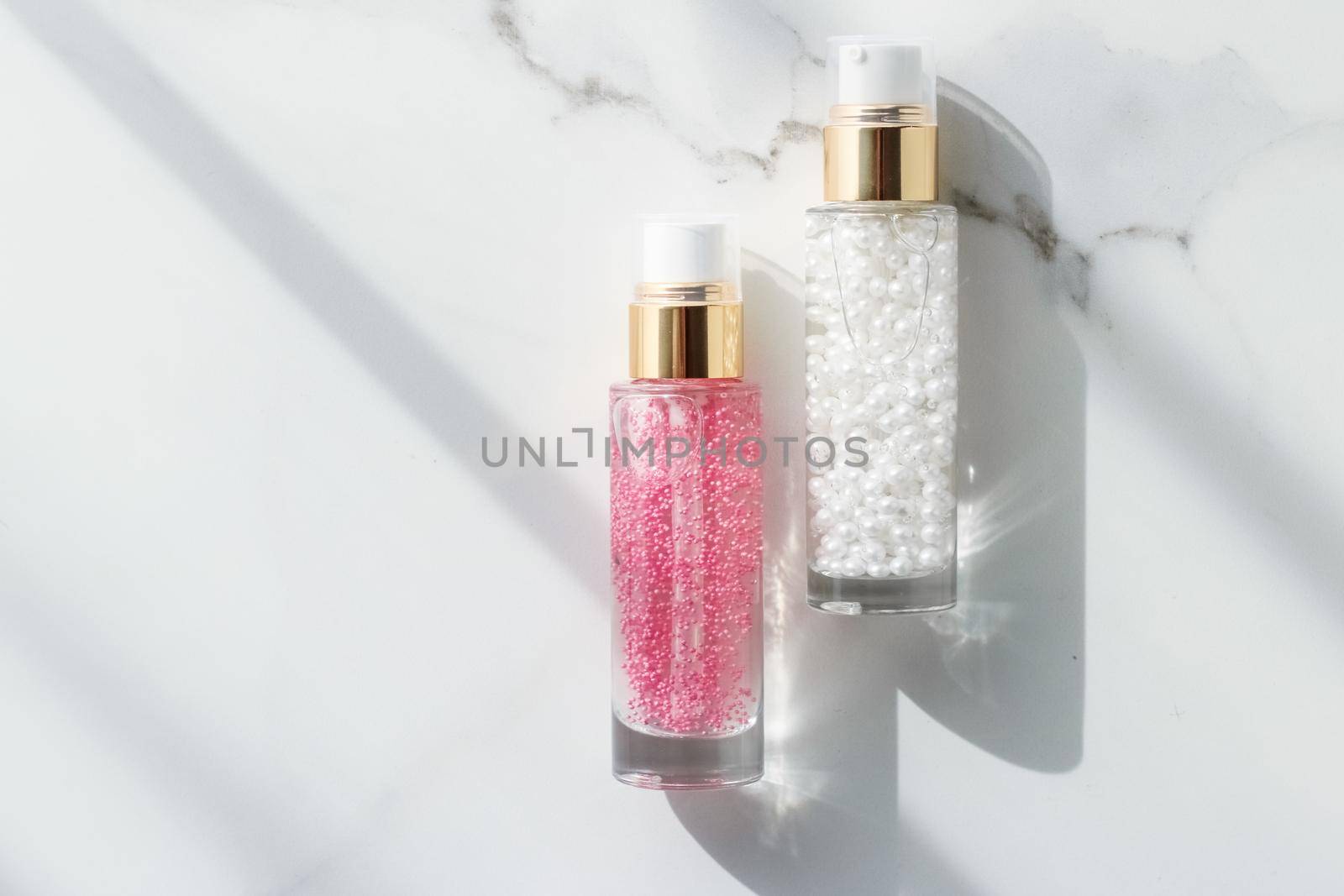 Cosmetic branding, packaging and make-up concept - Skin care serum and gel bottle, moisturizing lotion and lifting cream emulsion on marble, anti-age cosmetics for luxury beauty skincare brand design