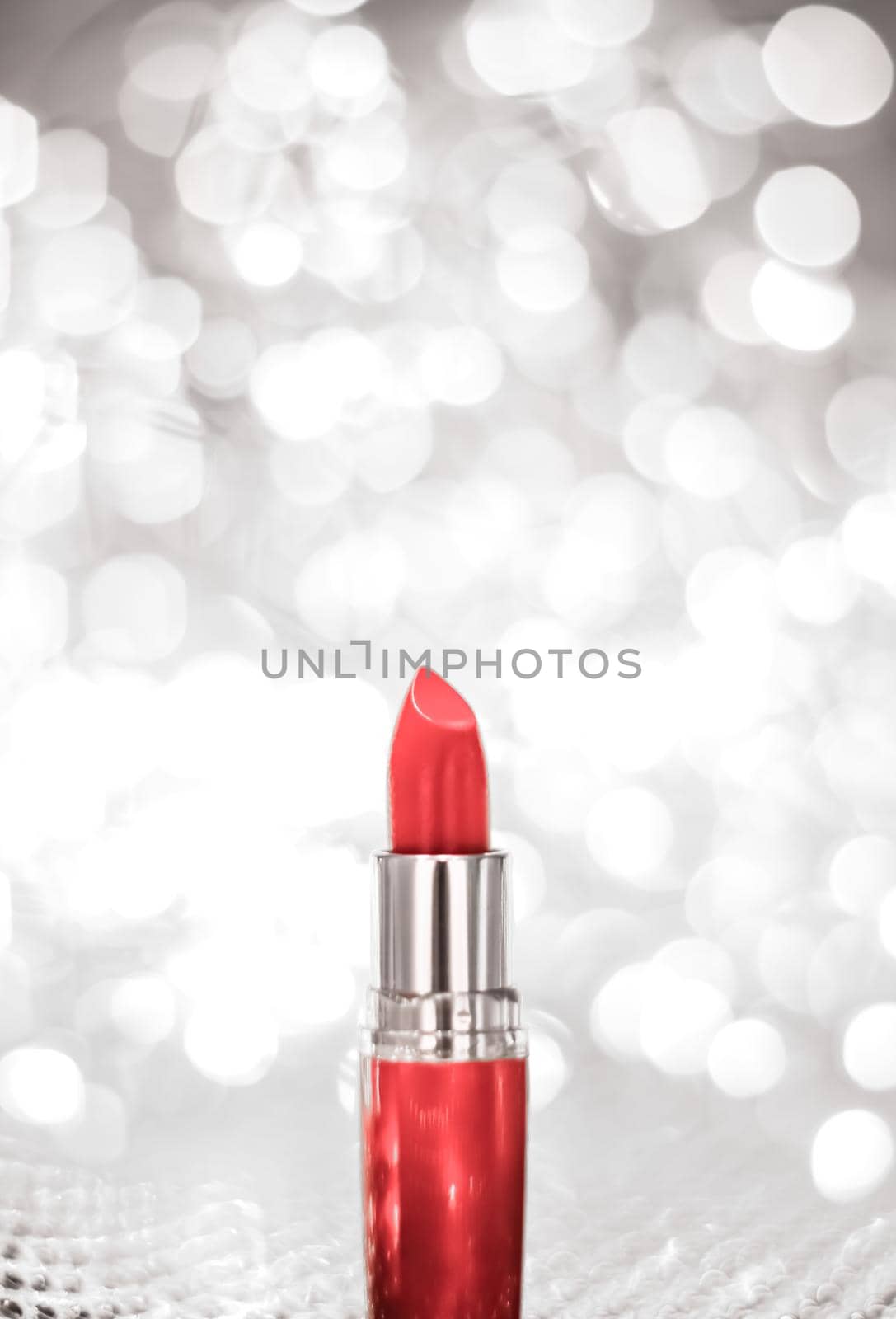 Cosmetic branding, sale and glamour concept - Coral lipstick on silver Christmas, New Years and Valentines Day holiday glitter background, make-up and cosmetics product for luxury beauty brand