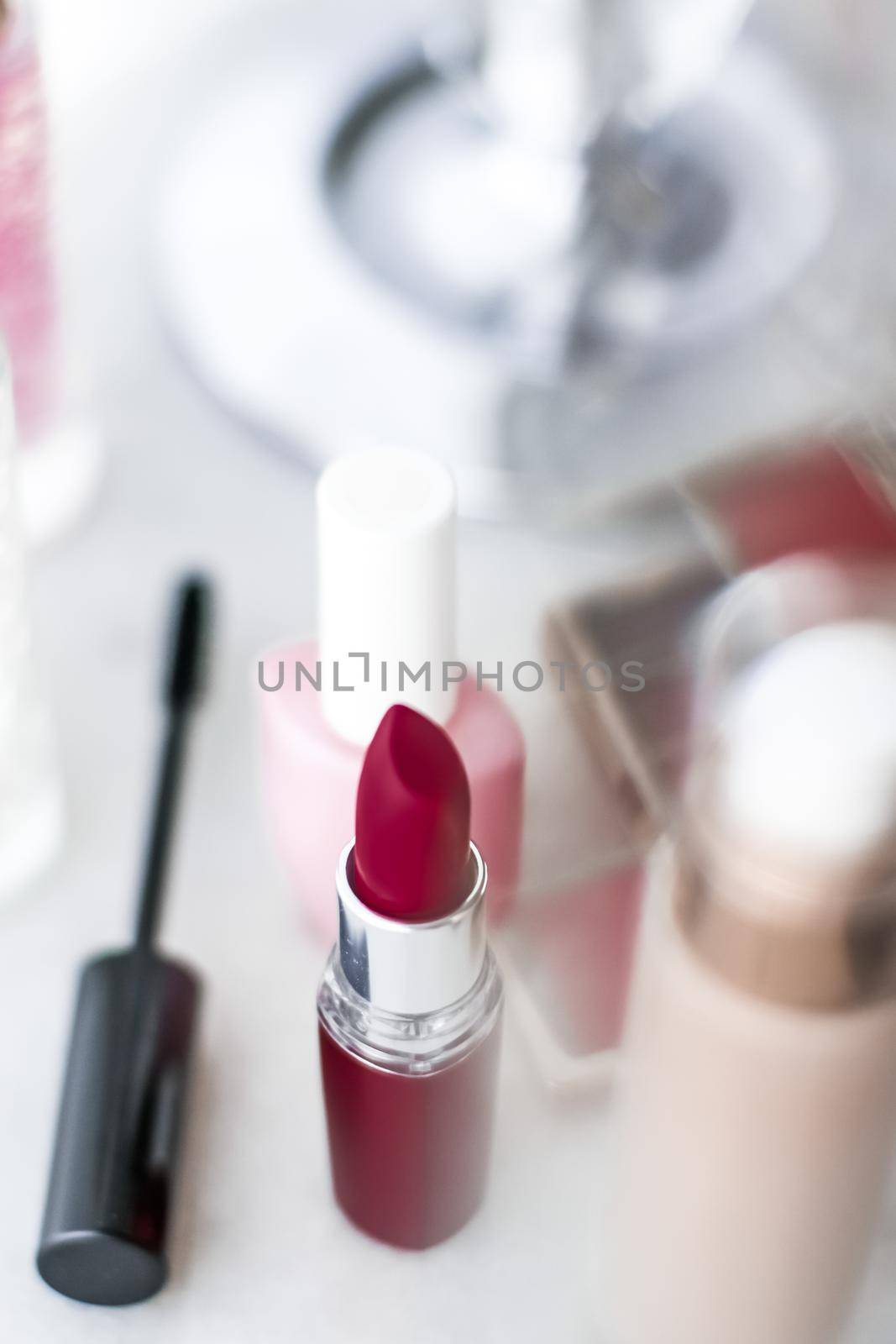 Cosmetic branding, girly and glamour concept - Cosmetics, makeup products on dressing vanity table, lipstick, foundation base, nailpolish and eyeshadows for luxury beauty and fashion brand ads design