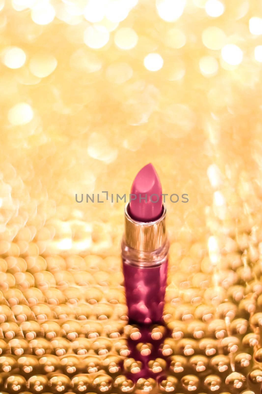 Rose lipstick on golden Christmas, New Years and Valentines Day holiday glitter background, make-up and cosmetics product for luxury beauty brand by Anneleven