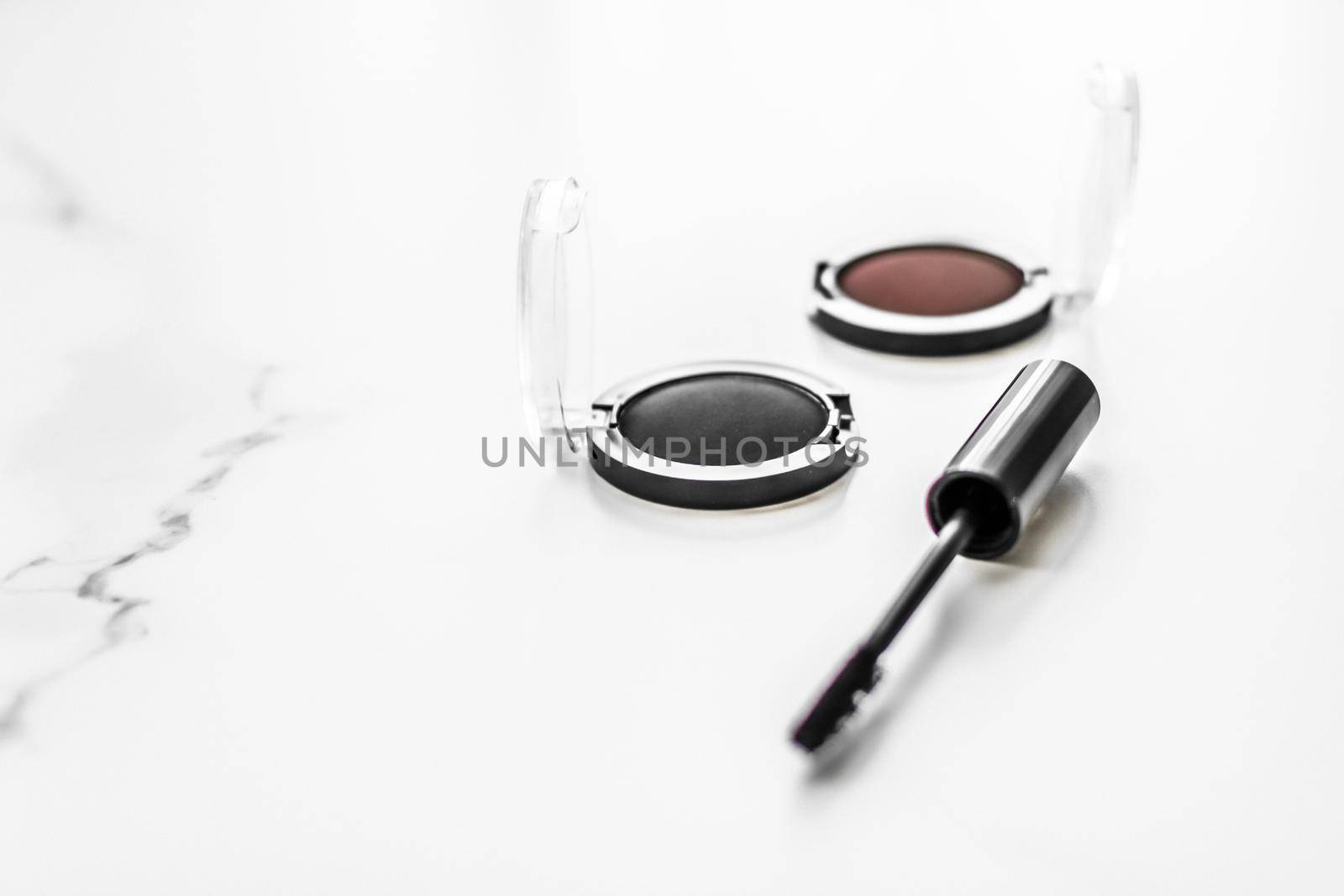 Cosmetic branding, blog and girly concept - Eyeshadows, black liner and mascara on marble background, eye shadows cosmetics as glamour make-up products for luxury beauty brand, holiday flatlay design