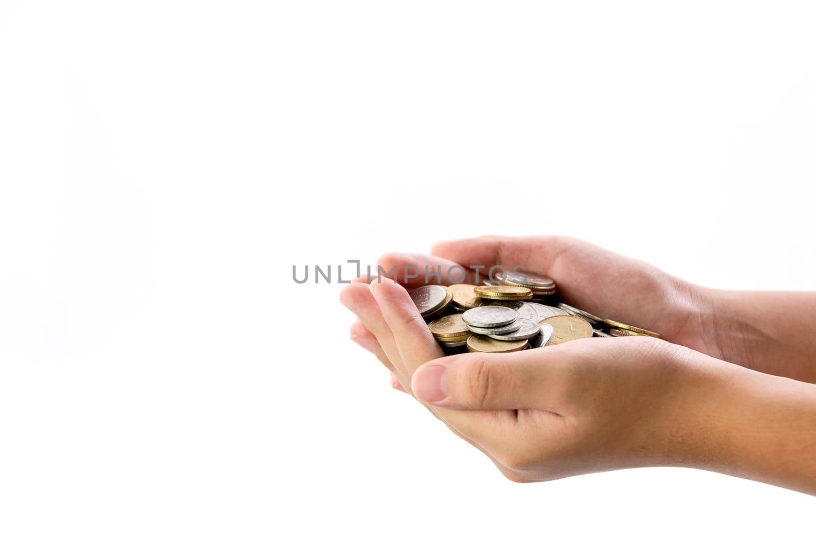 Human hand holding a lot of coins on white background, use for business and finance concepts.