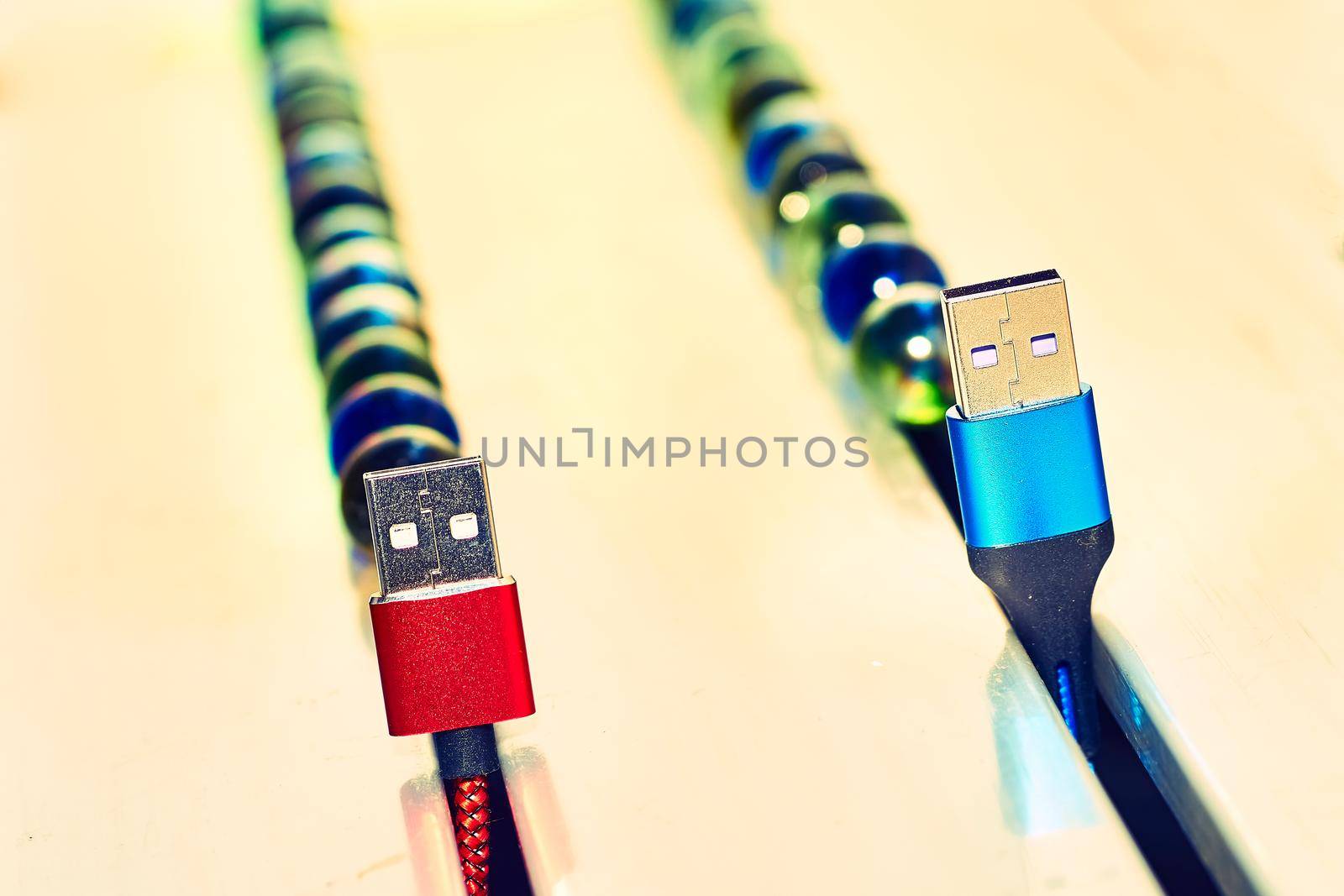 bring together or into contact so that a real or notional link is established. Connect and chat. Blue and red usb cables and colored balloons