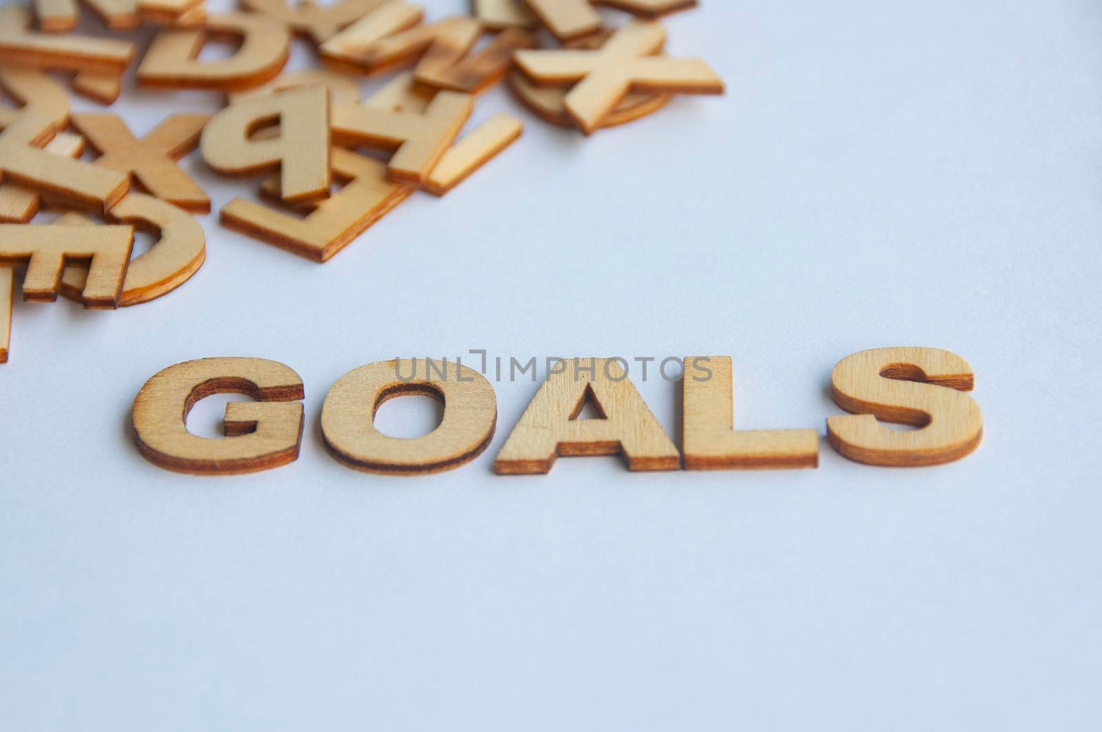 Goals text on while cover background. Setting goals concept.