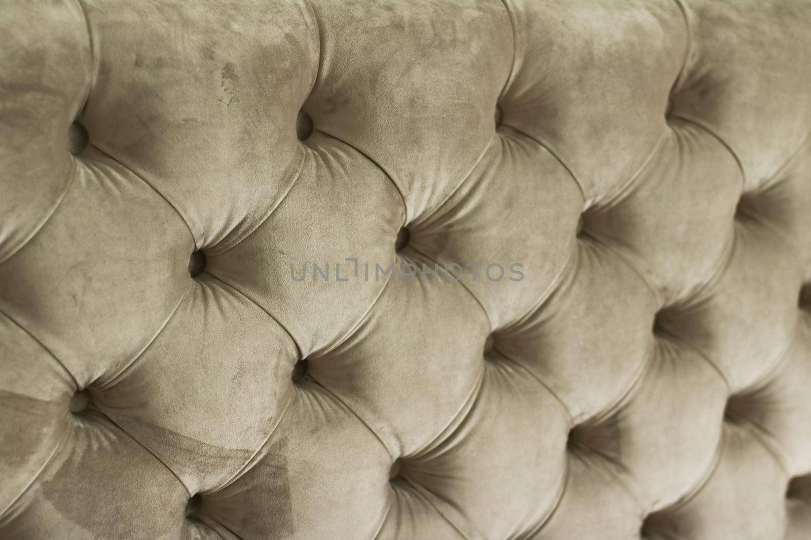 Luxury velour quilted sofa upholstery with buttons, elegant home decor texture and background by Anneleven