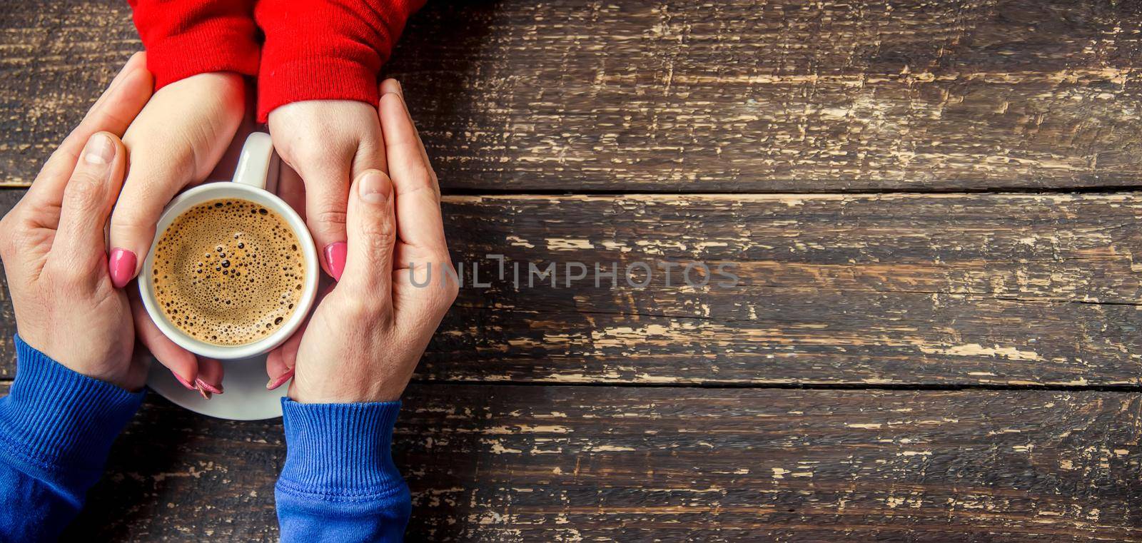 Cup drink for Breakfast in the hands of lovers. Selective focus.