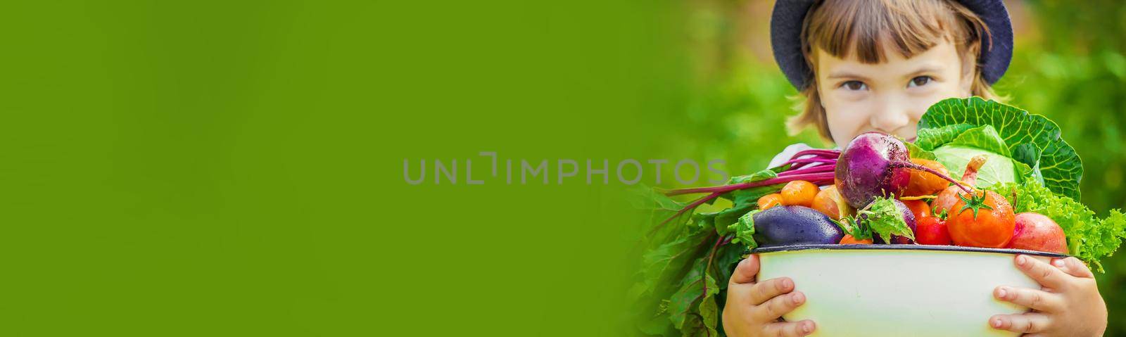 Child and vegetables on the farm. Selective focus. nature.