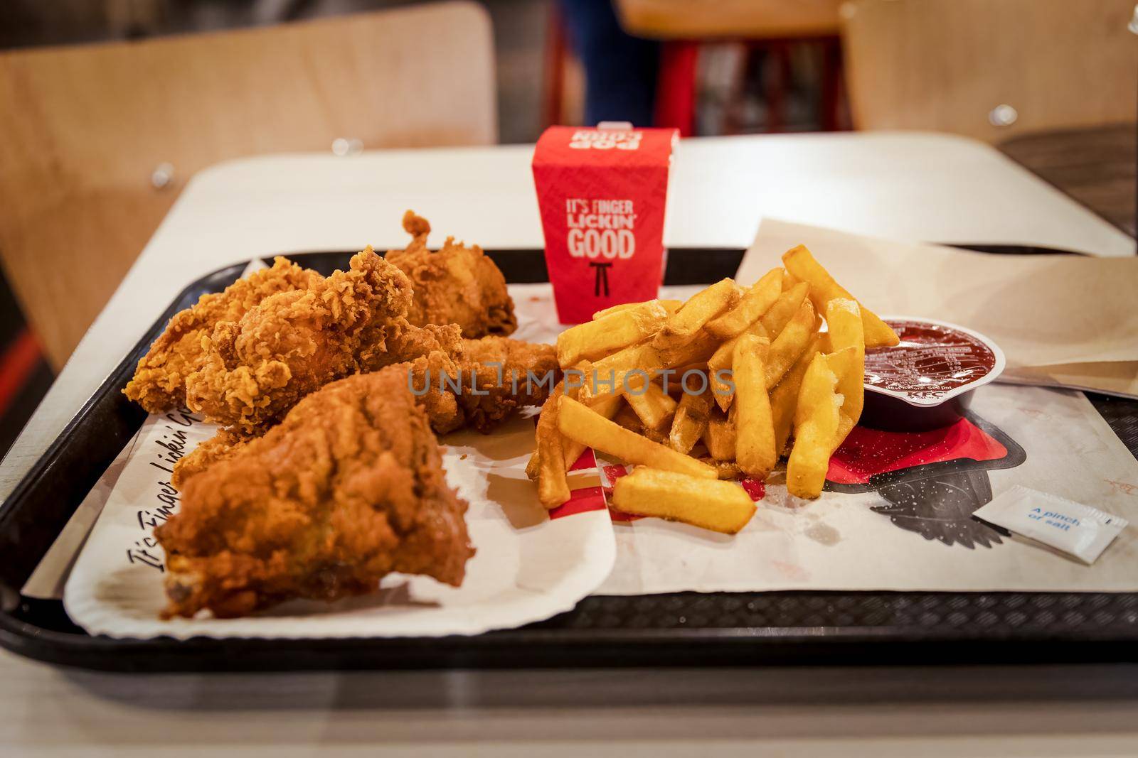 London, England - October 13 2021: KFC Mighty Bucket for One meal with additional chicken popcorn