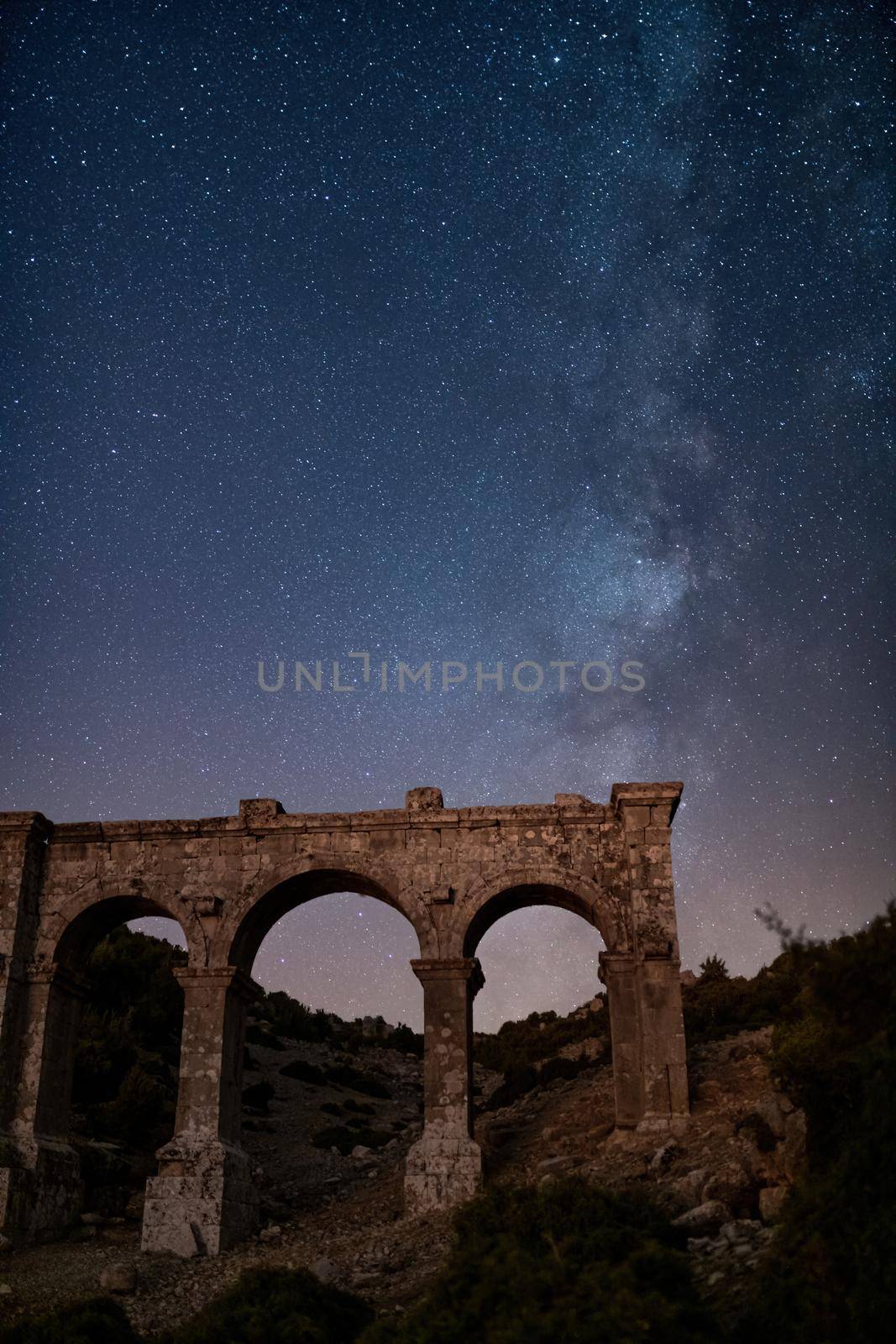 The ancient city of Ariassos, the city gate in a night when the Milky Way is visible by Sonat