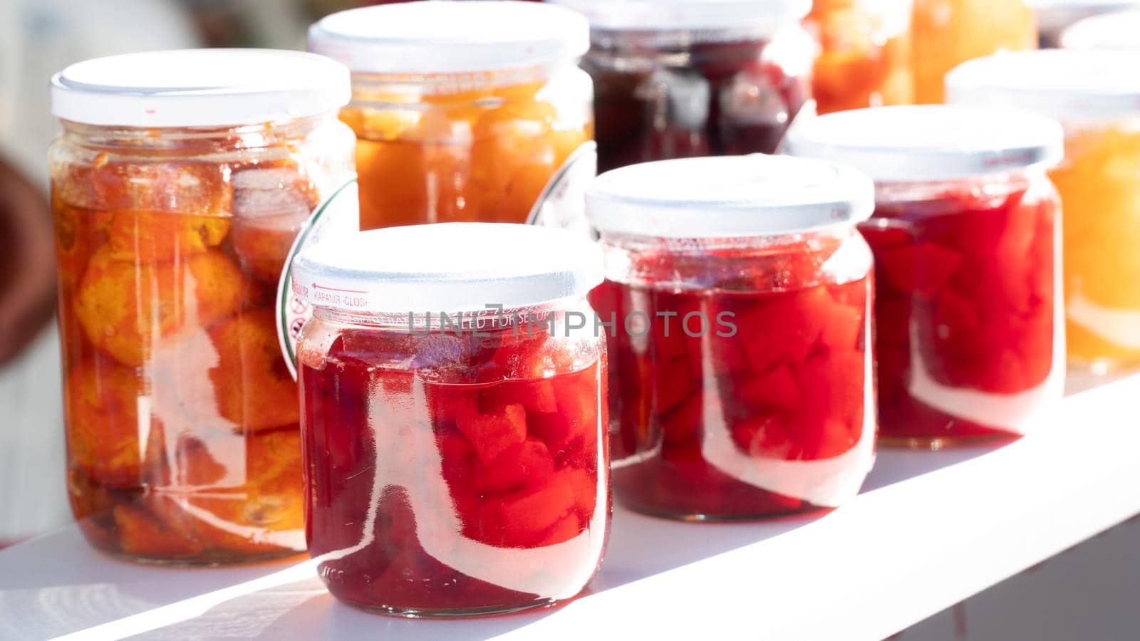 Glass jars with jam, canned sweet product by voktybre