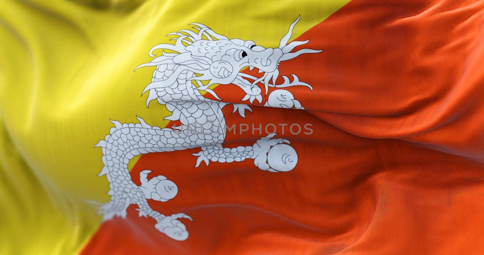 Close-up view of the Bhutan national flag waving in the wind by rarrarorro