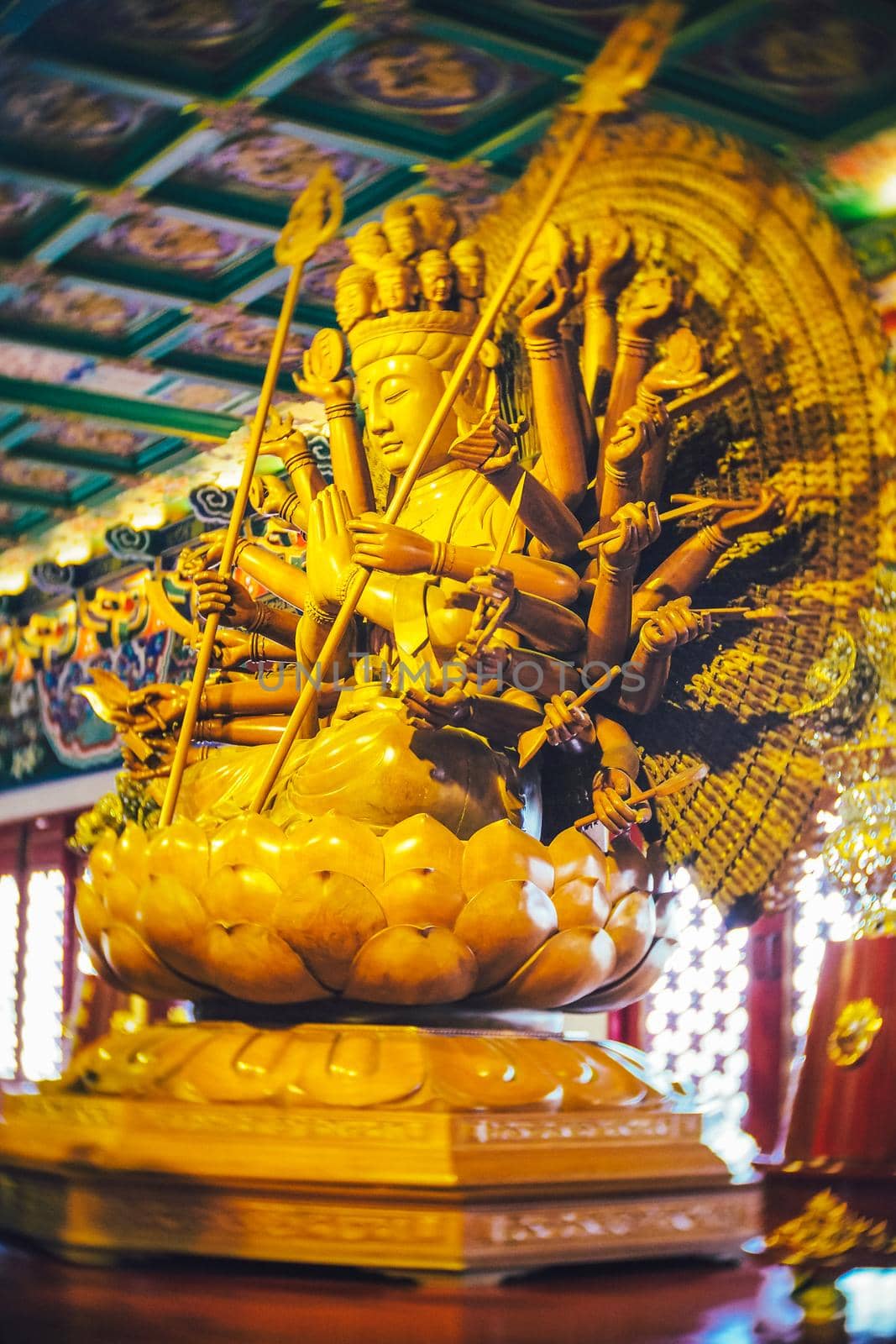 Guan yin lady chinese god wooden stute in religion temple.