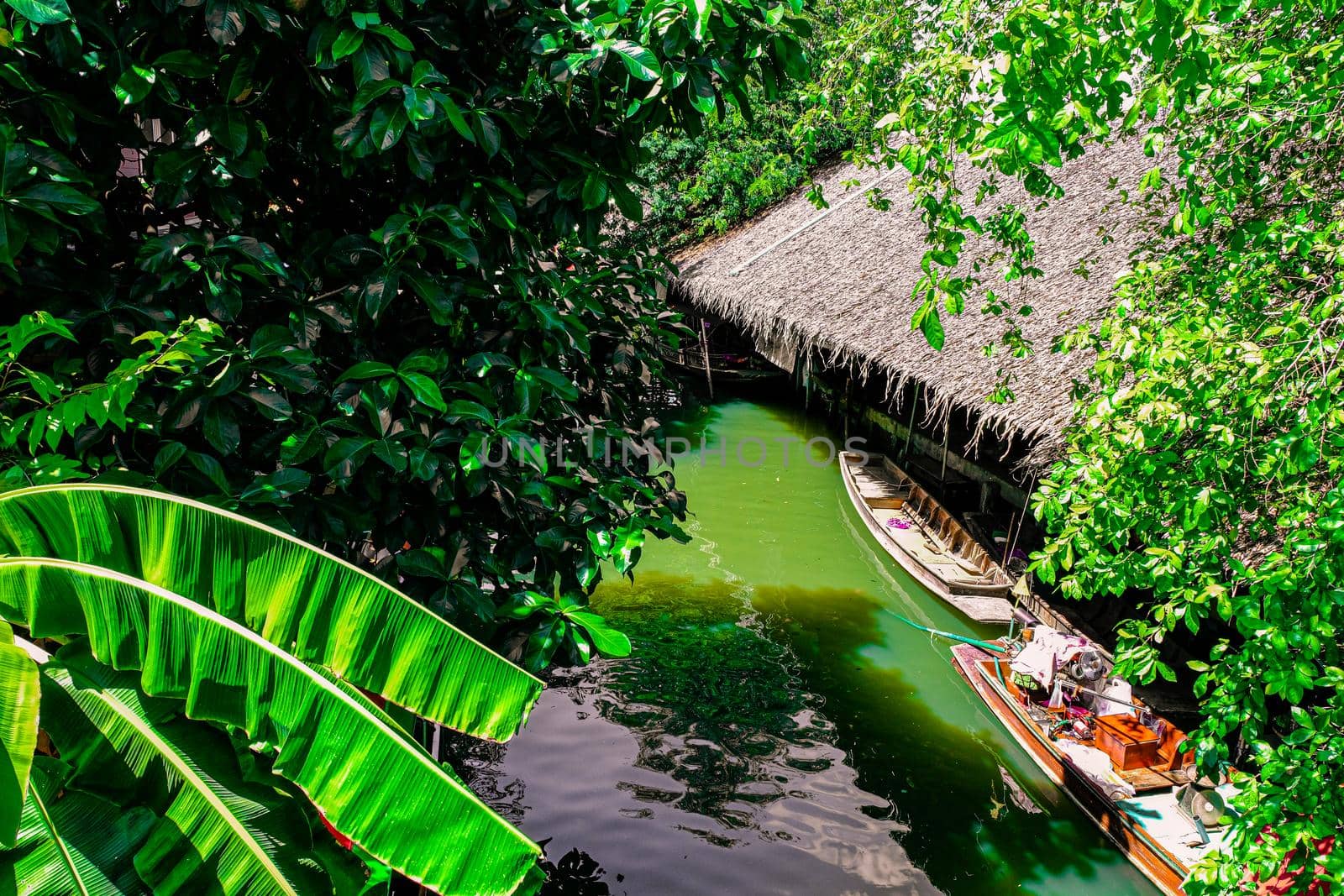 Local peoples sell fruits, food and souvenirs at floating market famous tourist attraction in Thailand