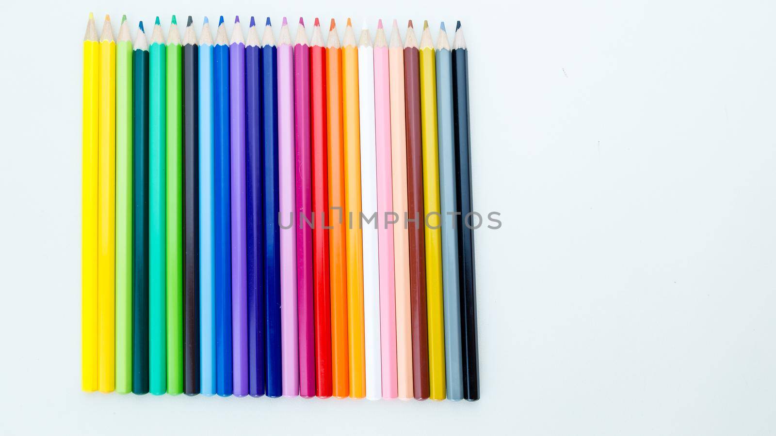 Colored pencil crayons in a row by imagesbykenny