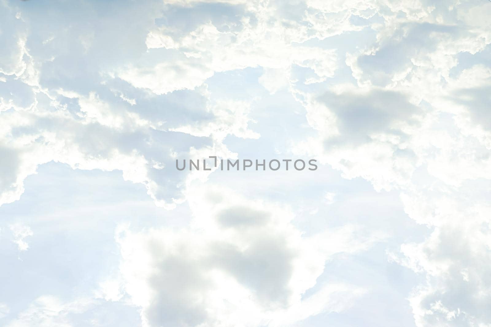 Abstract nature background with clouds in light tonality. White cumulus clouds
