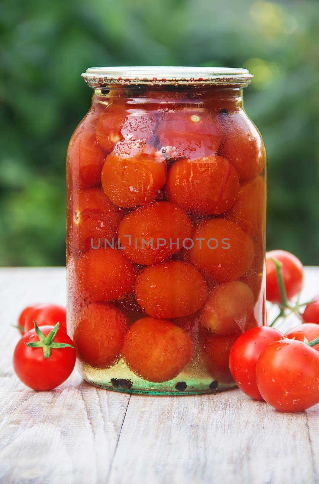 Preserved tomatoes in cans. Selective focus. Food