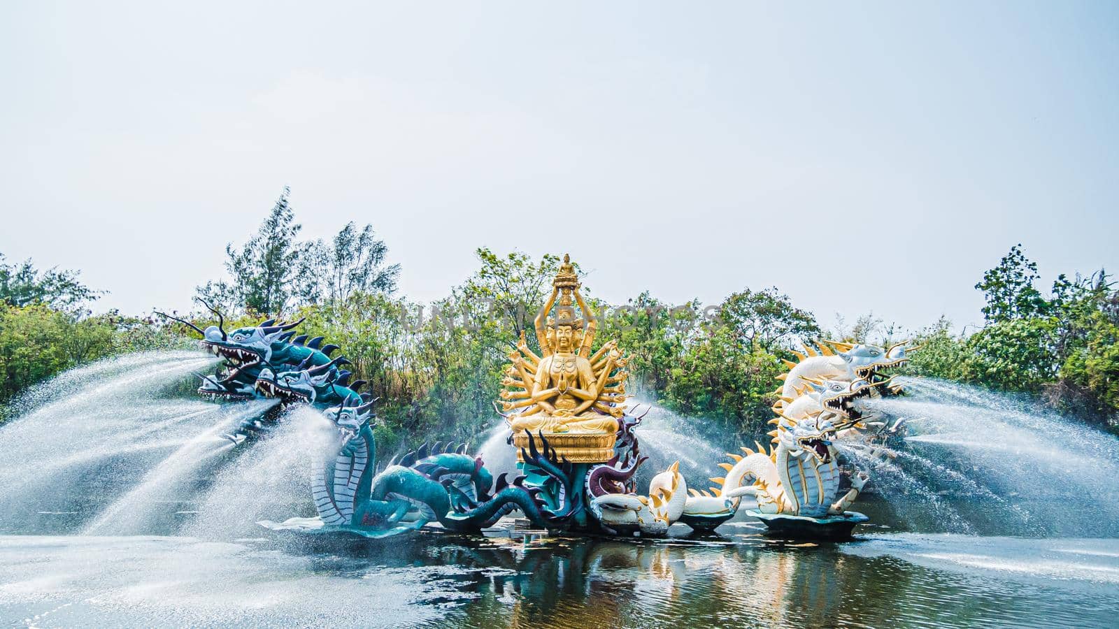 China God Statue Fountain. God Fountain Cement Artwork Statuary in pond landscape.