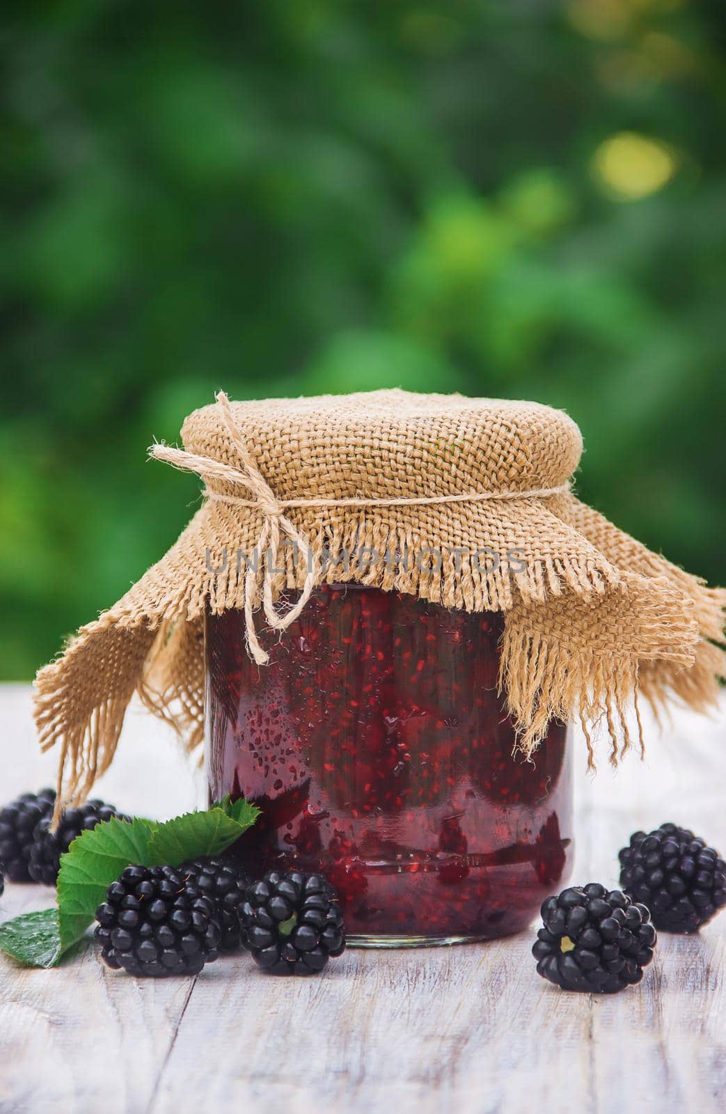 homemade jam with blackberry. Preparation. Selective focus. by yanadjana