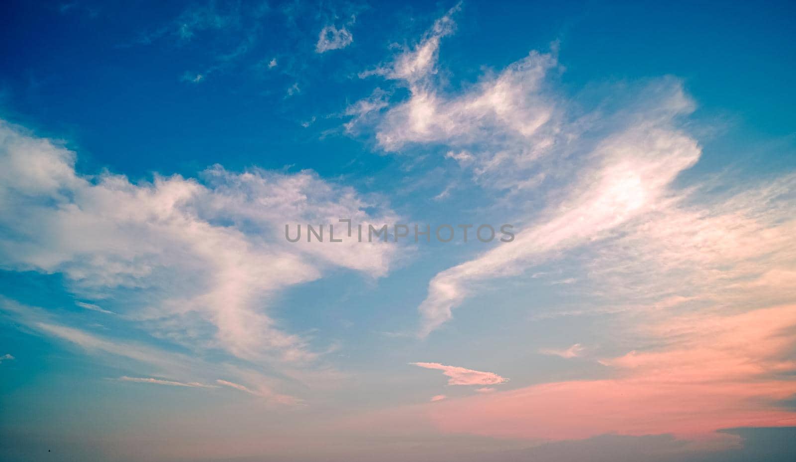 Clouds twilight sky in pastel color Pink and blue, colorful spiritual background.