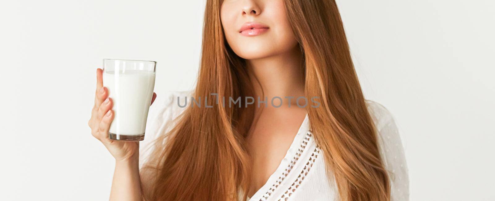 Diet, health and wellness, woman holding glass of milk or protein shake cocktail by Anneleven