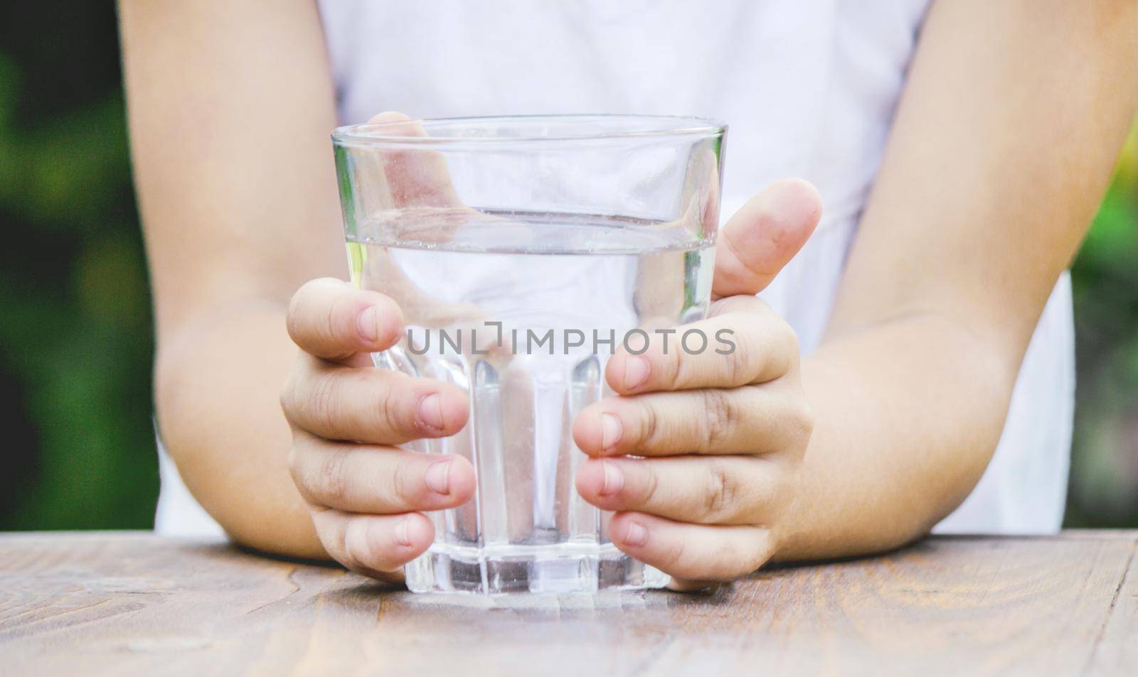 child glass of water. selective focus. food and drink. nature