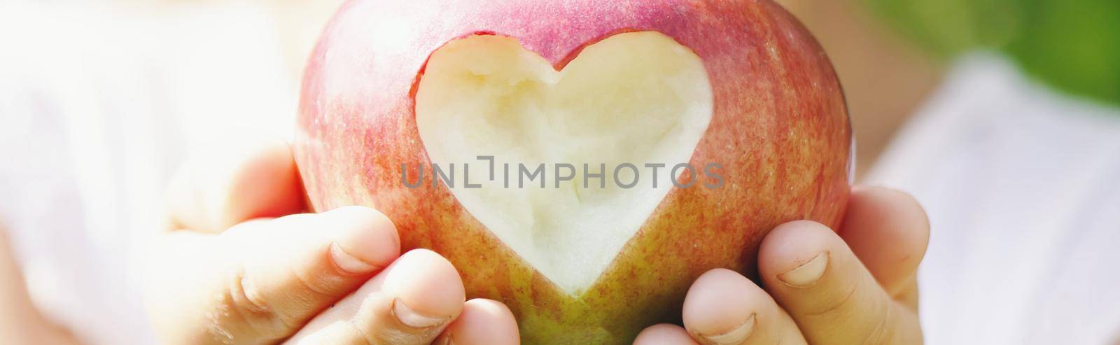 Child with Child with an apple. Selective focus. by yanadjana