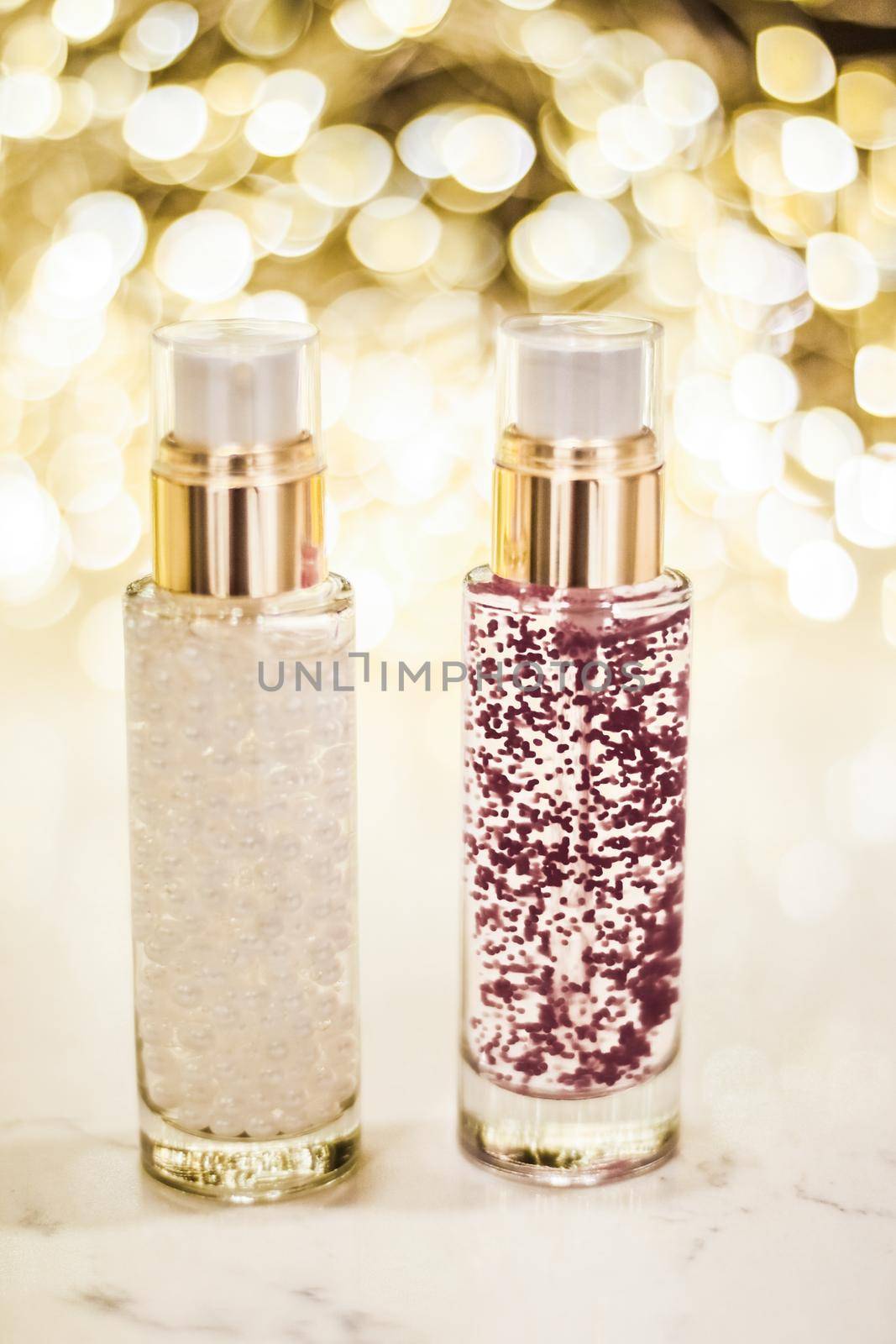 Cosmetic branding, blank label and glamour present concept - Holiday make-up base gel, serum emulsion, lotion bottle and golden glitter, luxury skin and body care cosmetics for beauty brand ads