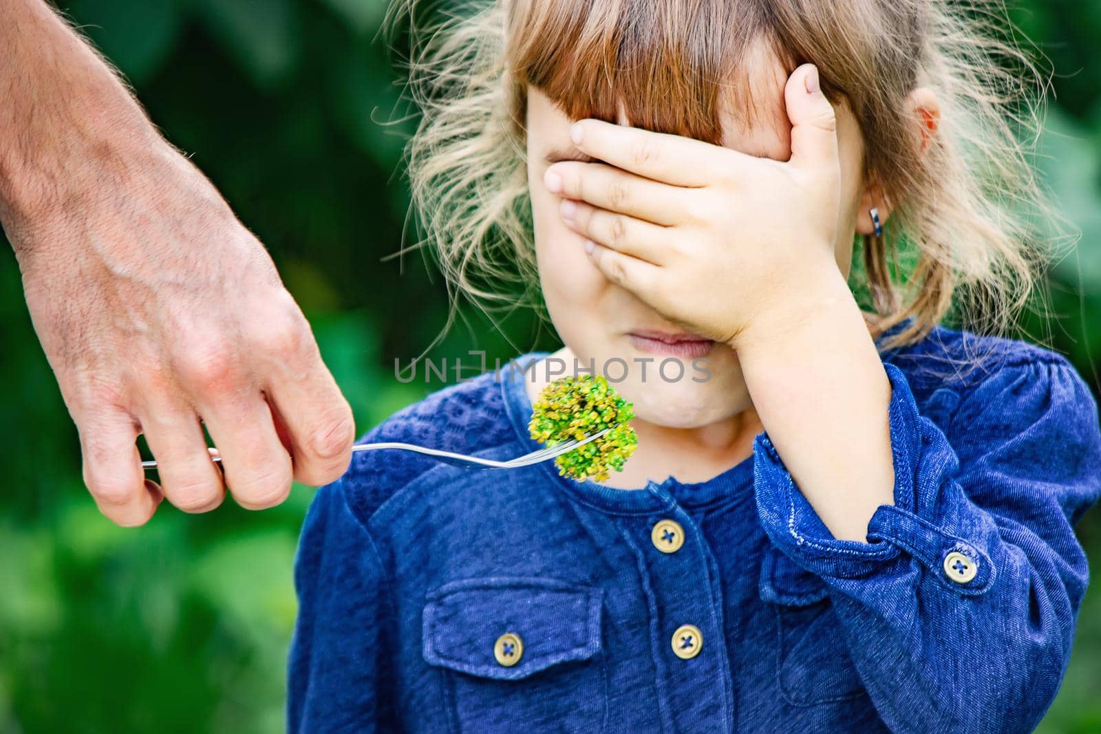 child eats vegetables. Summer photo. Selective focus nature