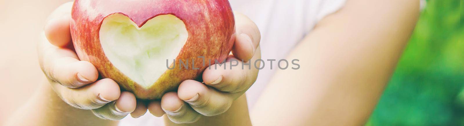 Child with Child with an apple. Selective focus. by yanadjana