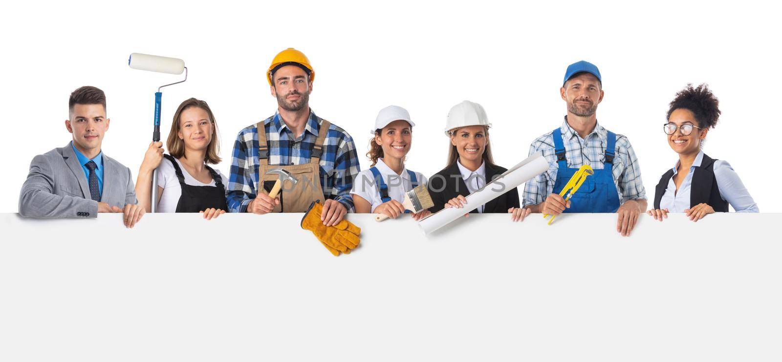 Portrait of happy construction workers and managers holding blank billboard isolated on white background, empty copy spcae for text content