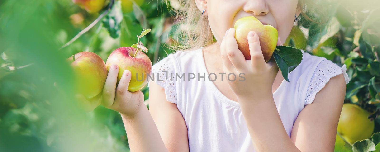Child with Child with an apple. Selective focus. Garden Food