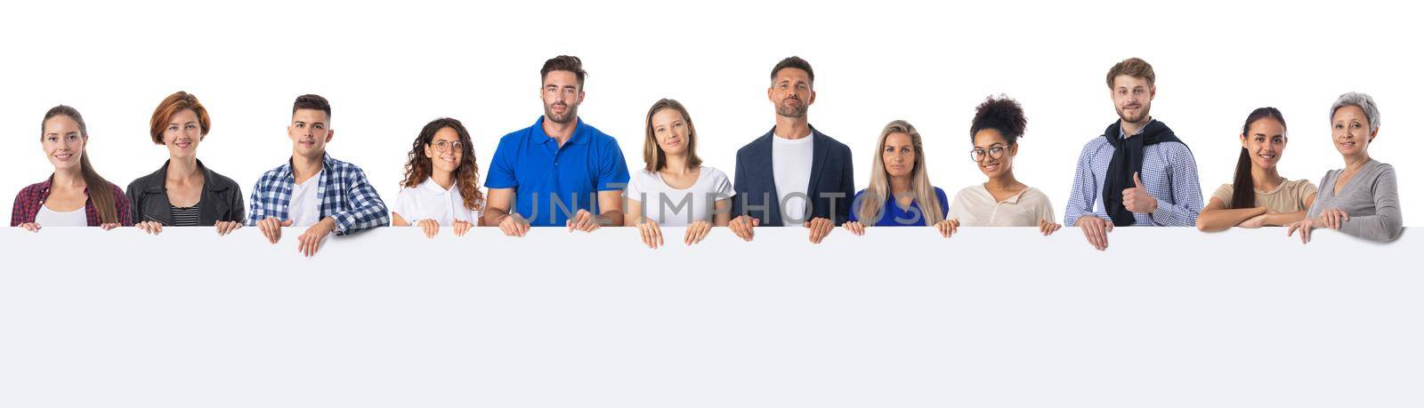 Group of happy people standing together and holding a blank banner sign for text content, isolated on white background