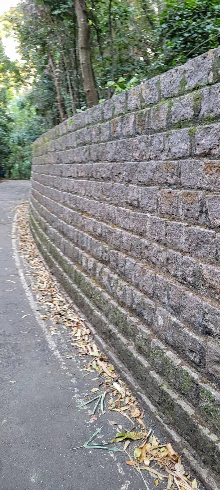 old brick wall of dark stones by sarsa