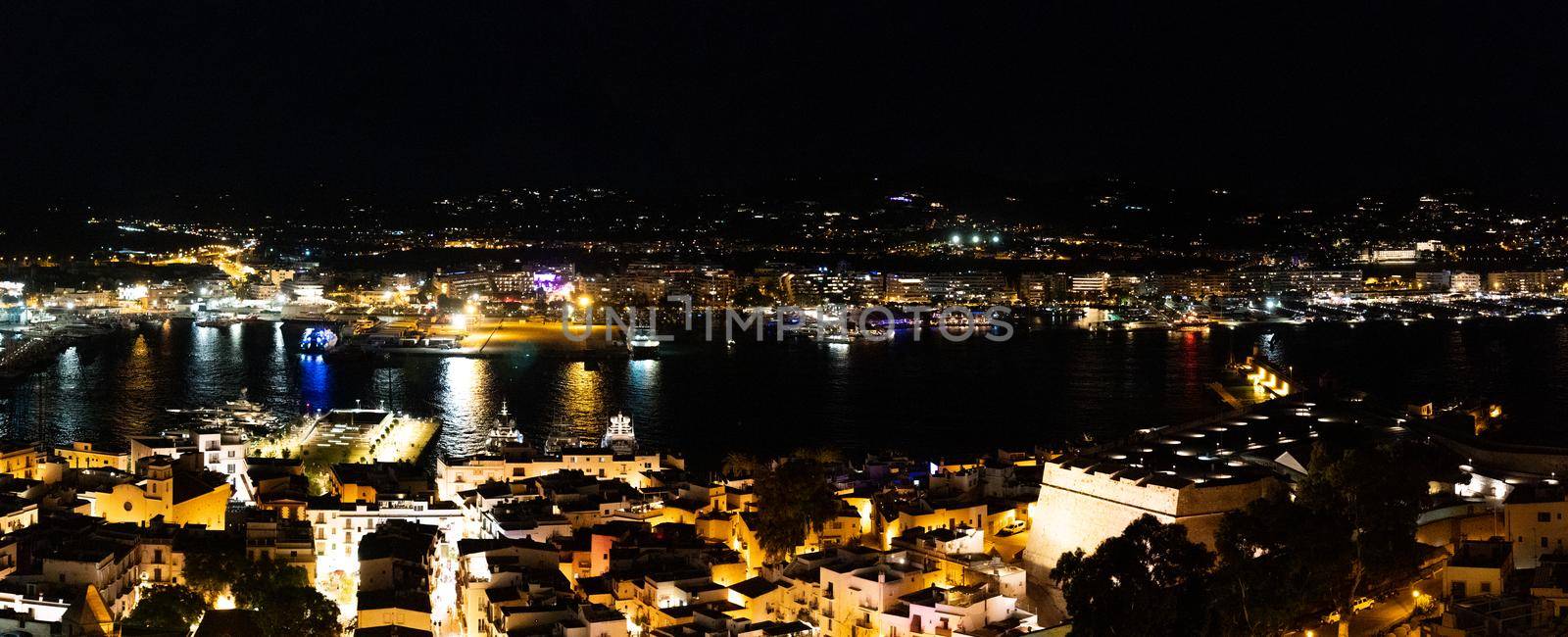 Panoramic night scene of the port of Ibiza town by LopezPastor